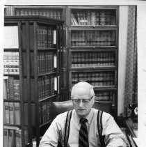 Justice Bertram D. Janes, sitting at the desk in his office, typing. He was about to retire