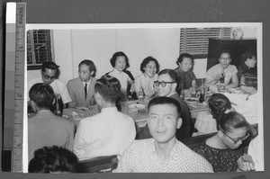 Men and women eating in a dining room, Ing Tai, Fujian, China, ca. 1940-1950