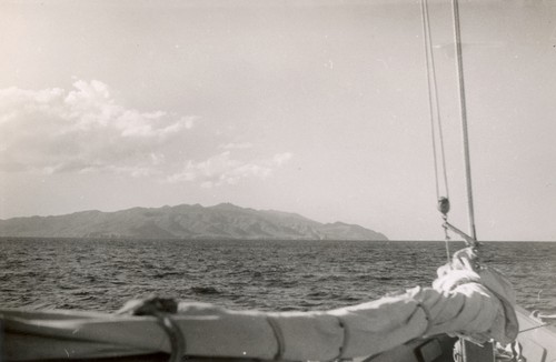 Revelle [View of land over sail of R/V E.W. Scripps]