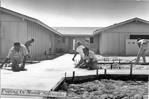 Putting in manor sidewalks during the construction of Leisure World