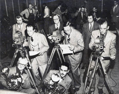 Photo journalists using 16mm cameras