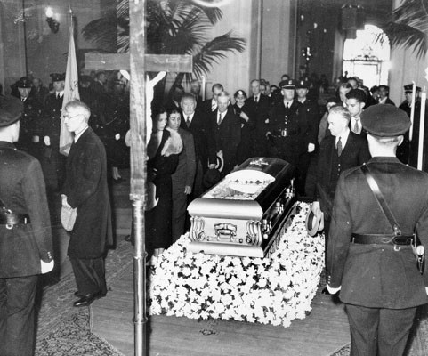 [Mourners pass the coffin of Annie Laurie]