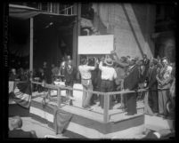 Los Angeles City Hall's cornerstone being lowered down to its place during ceremonies in 1927