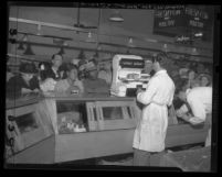 Customers at meat counter of Los Angeles' Grand Central Market in 1946