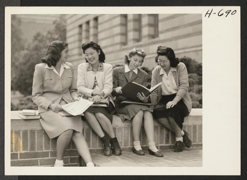 Michiko Kataoka, a freshman, and Meriko Hoshiyama, a junior, both from Manzanar (left to right in picture), with fellow students