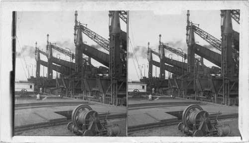 Ore unloaders (capacity 10 tons each) from deck of ore - laden vessels, Cleveland, Ohio