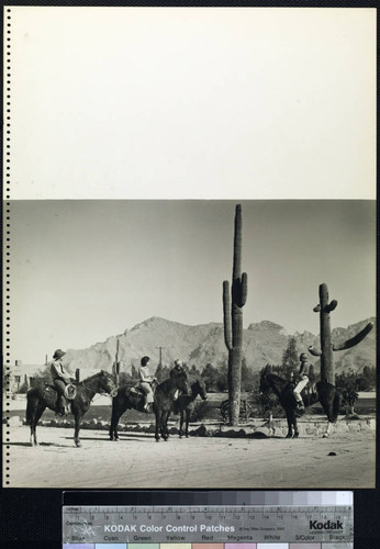 Rancho Nezhone. Horseback riders and cactus