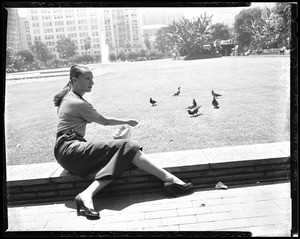 Blind girl feeding pigeons, 1957