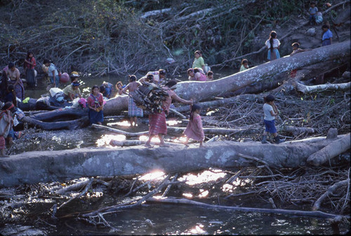 Guatemalan refugee women and children wash themselves and their clothes in the rive, Puerto Rico, 1983