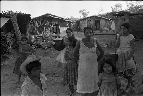 A family outside their home, Morazán, 1983