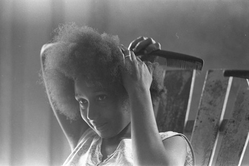 Woman combing her hair, San Basilio de Palenque, 1977