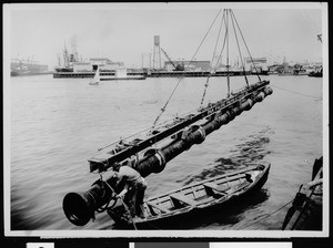 Cast iron sewer line about to be placed in the main ship channel in Los Angeles Harbor, 1933