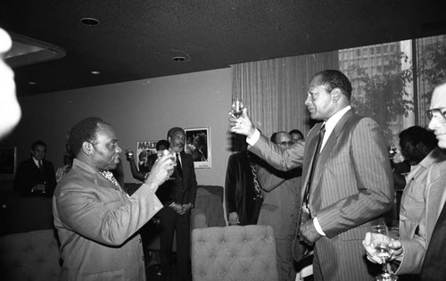 Tom Bradley toasting the speaker of an International Club of Los Angeles event, Los Angeles, 1981