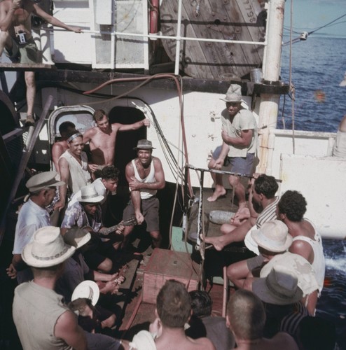 Joe and Bob Masters dance to music played by Palmerston natives aboard the R/V Horizon