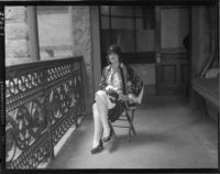 Mrs. Marie Earl, seated, poses for a photograph