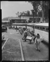 Undocumented Mexican workers board buses for deportation, Los Angeles, 1954