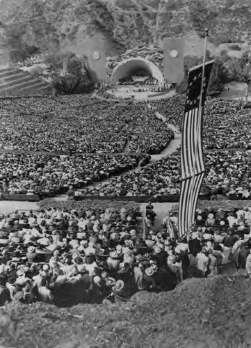 Welcoming event at the Hollywood Bowl to honor Madame Chiang Kai Shek for her visit to the U.S. to raise funds in support of China's fight against Japan during WWII. An American flag is hung on the side with only 13 stars