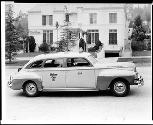 De Soto taxi cab owned by the Yellow Cab Company parked on a Los Angeles street, 1940-1950