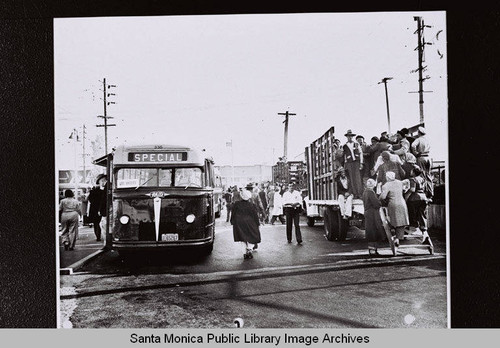 "Special" Santa Monica Bus at Rimpau and Pico Blvd. with truck transport for Douglas Aircraft Company Santa Monica plant workers during the the Los Angeles 24-hour street car strike on July 22, 1943