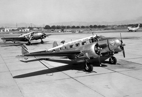 Two C-45 military transports at Van Nuys Airport Air National Guard ramp, 1976