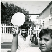 Martinez siblings playing table tennis, East Los Angeles, California