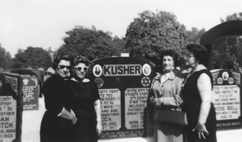 Sisters at parents' grave