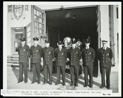Station No. 6 B Platoon, standing in front of open bay doors, 1355 W. 1st St