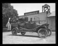 Unidentified man and boy in Sawtelle Fire Engine, Calif., circa 1925