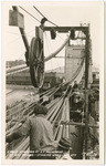 Cable spinning at S.F. anchorage of Bay Bridge, spinning wheel on left, # 1036