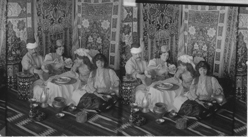 Feasting in the Harem, typical costumes and furniture, Turkey