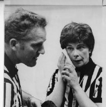 Mary Henry (refereeing a boys basketball game). Caption of photos 3272, 3273 and 3274: Referee Mary (or possibly Marie) Henry gets ready for the center jump, left, then races downcourt on a fast break, center, and takes a breather during a timeout