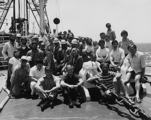 Entire crew on the foredeck of the D/V Glomar Challenger (ship) during Leg 79 of the Deep Sea Drilling Project. 1981