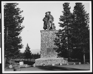Monument in Truckee dedicated to the Donner Party, depicting a pioneer family, 1830-1860 (ca.1980?)
