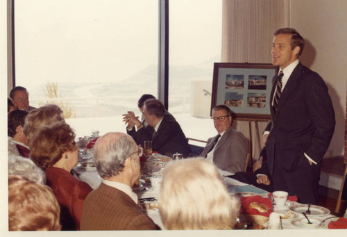 President Banowsky speaking at the Luncheon, Mrs. Seaver (L)