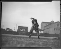 Gil Kuhn, center on the USC Trojans football team, running on a sports field at USC, Los Angeles, 1935