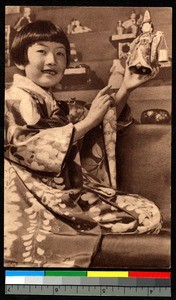 Girl with figurine, Japan, ca.1920-1940
