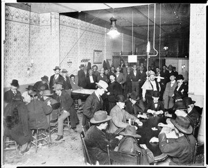 Crowds of men gabling in a casino, ca.1900