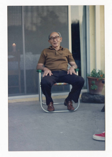 Sueo Saito sitting on a lawn chair