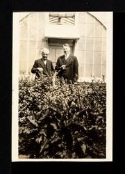 Luther Burbank and Charles Hampton in front of Greenhouse