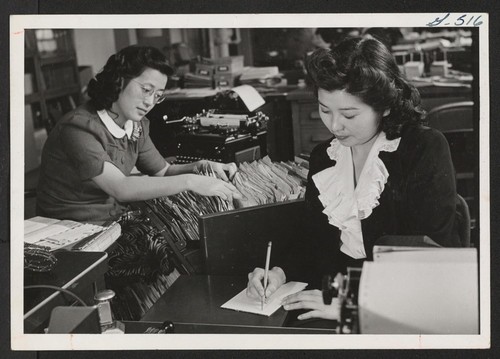 Pat Urushima and Tami Nakaguchi, both from Jerome Relocation Center, are now working for the Public Health Service at Bethesda, Maryland, using the secretarial experience which they received in the center. Photographer: Van Tassel, Gretchen Bethesda, Maryland