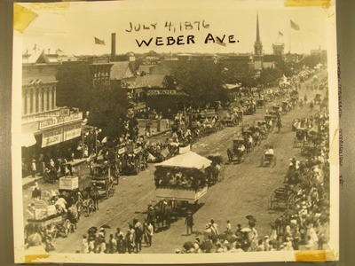 Stockton - Centennial Celebration: Centennial Parade on Weber Ave. Hammond Moore and Yardley Grocers and Lime Dealers