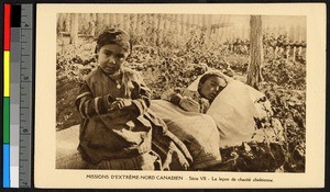 Boy sitting beside a sick boy's bedroll, Canada, ca.1920-1940