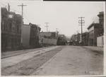 [View along Valencia St. before fire. Valencia St. Hotel sunk three stories into old marsh (Lake McCoppin)]