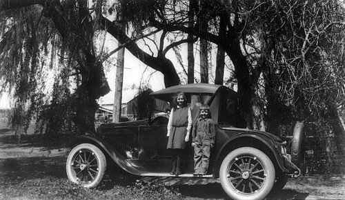 Kids and new car, (c. 1935), photograph