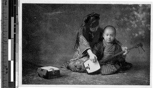 Two children playing the shamisen, Japan, ca. 1920-1940