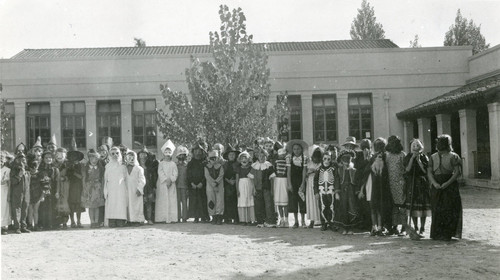 Students in Halloween costumes in front of Central Elementary School in Banning, California