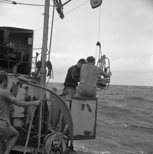 Oceanographer's doing some scientific research aboard the Scripps Institution of Oceanography's research vessel Horizon. Circa 1967