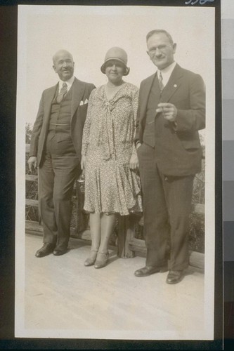 [Henry Wallace ? wife, and another man]