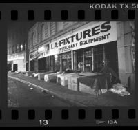 Homeless sleeping in boxes along storefronts in Los Angeles, Calif., 1987
