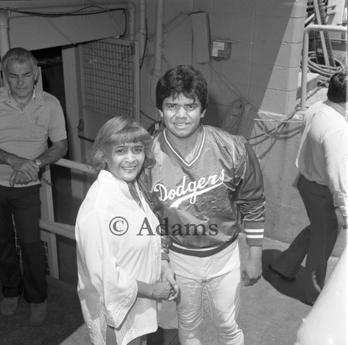 Ethel Bradley posing with Fernando Valenzuela at Dodger Stadium, Los Angeles, 1973